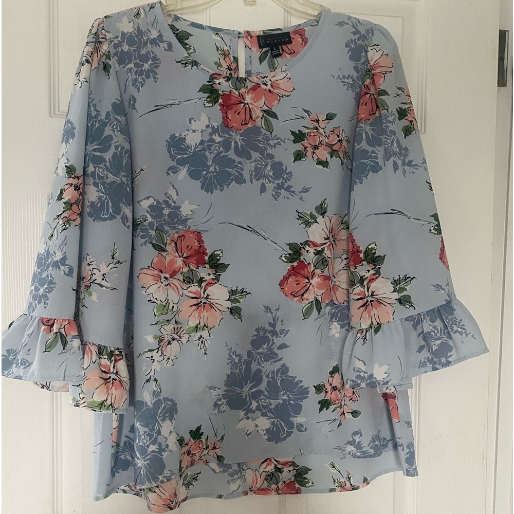 Light blue  blouse with large pink flowers size small. Like new condition.